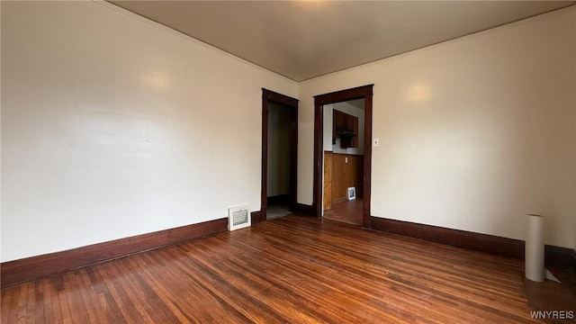 1890 Linwood Ave, Niagara Falls, NY 14305 - spare room featuring baseboards and dark wood-style floors