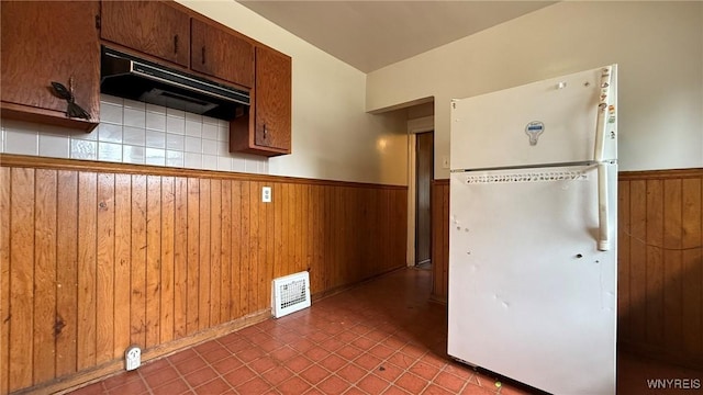 1890 Linwood Ave, Niagara Falls, NY 14305 - kitchen with freestanding refrigerator, wainscoting, wood walls, and range hood