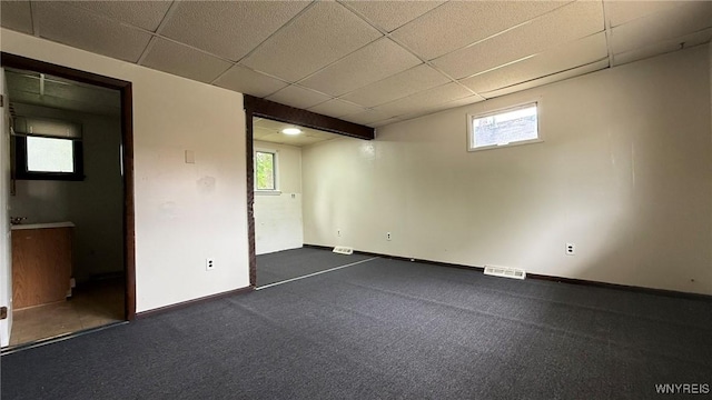 1890 Linwood Ave, Niagara Falls, NY 14305 - basement featuring a paneled ceiling and plenty of natural light