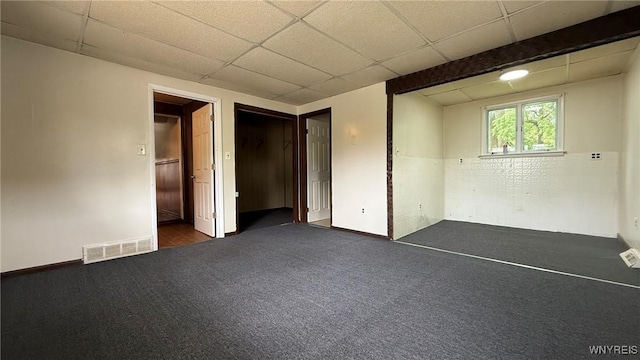 1890 Linwood Ave, Niagara Falls, NY 14305 - unfurnished bedroom with dark colored carpet and a drop ceiling