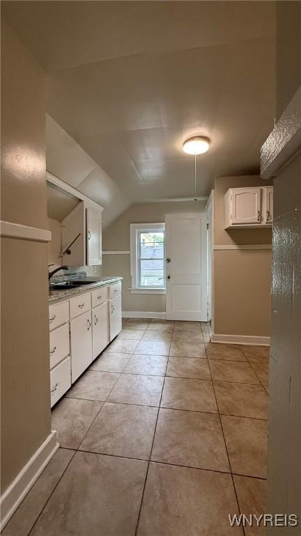 1890 Linwood Ave, Niagara Falls, NY 14305 - bathroom featuring vanity, lofted ceiling, and tile patterned floors