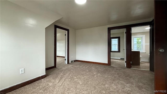 1890 Linwood Ave, Niagara Falls, NY 14305 - carpeted spare room featuring baseboards and baseboard heating