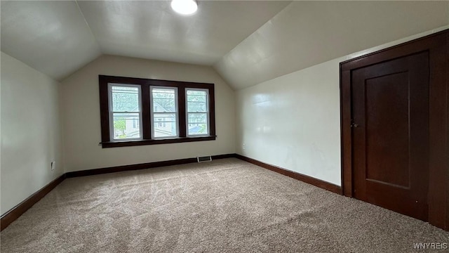 1890 Linwood Ave, Niagara Falls, NY 14305 - additional living space featuring light carpet and vaulted ceiling