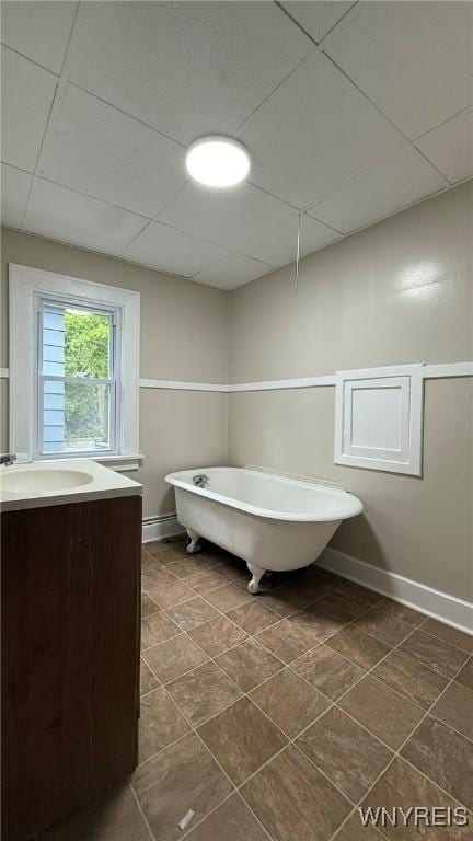 1890 Linwood Ave, Niagara Falls, NY 14305 - bathroom featuring a drop ceiling, a freestanding bath, and vanity