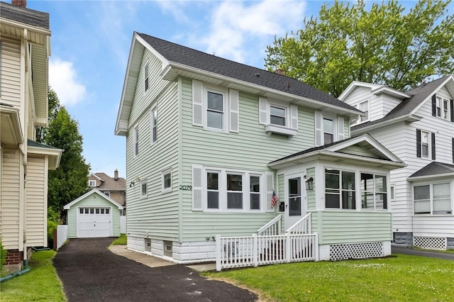 2079 Clifford Ave, Rochester, NY 14609 - view of front of property featuring asphalt driveway, an outbuilding, entry steps, a detached garage, and a front yard