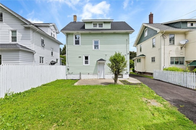 2079 Clifford Ave, Rochester, NY 14609 - back of house featuring a patio and a chimney