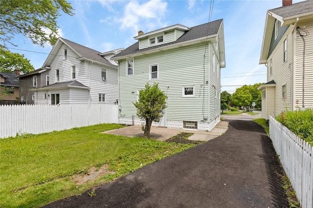 2079 Clifford Ave, Rochester, NY 14609 - rear view of property with a patio area, a chimney, driveway, and roof with shingles