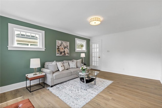2079 Clifford Ave, Rochester, NY 14609 - living room with healthy amount of natural light, wood finished floors, and ornamental molding