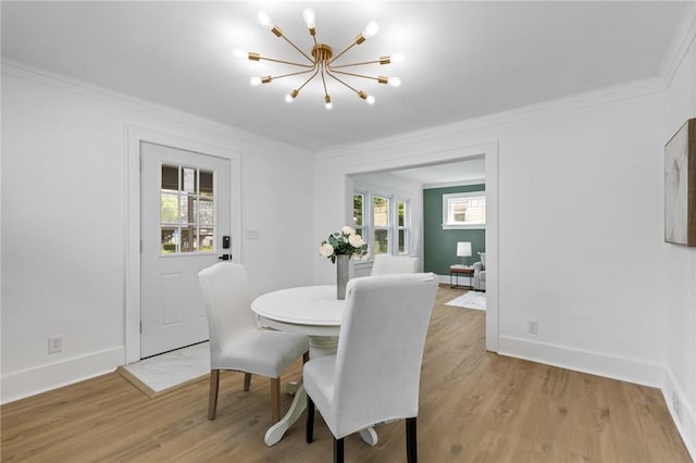 2079 Clifford Ave, Rochester, NY 14609 - dining area featuring a chandelier, ornamental molding, and light wood-style flooring