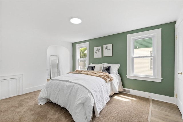 2079 Clifford Ave, Rochester, NY 14609 - bedroom featuring baseboards and arched walkways