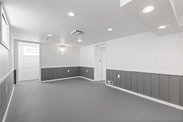 2079 Clifford Ave, Rochester, NY 14609 - unfurnished room featuring concrete floors, wainscoting, and recessed lighting