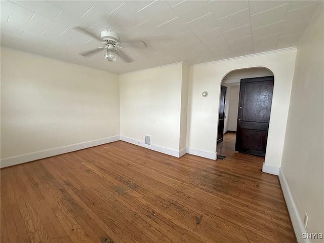211 Pharis St, Syracuse, NY 13204 - empty room featuring arched walkways, a ceiling fan, and hardwood / wood-style floors