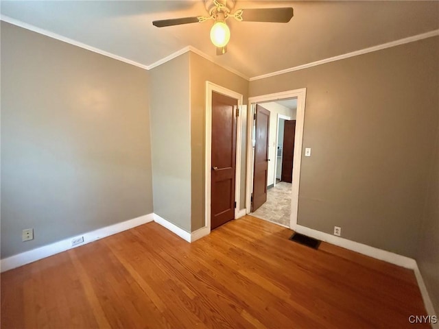 211 Pharis St, Syracuse, NY 13204 - spare room with wood finished floors, a ceiling fan, and ornamental molding