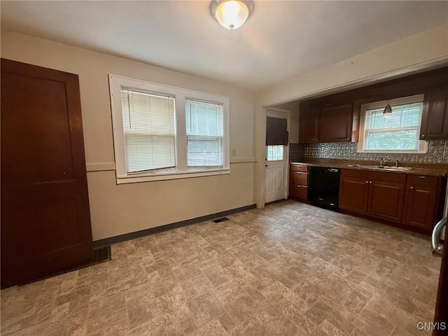 211 Pharis St, Syracuse, NY 13204 - kitchen with dishwasher, backsplash, and dark countertops