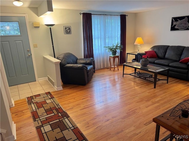8467 Torchwood Ln, Cicero, NY 13039 - living room with healthy amount of natural light and light wood-style floors