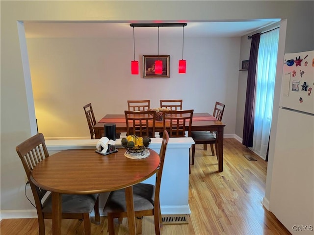 8467 Torchwood Ln, Cicero, NY 13039 - dining room featuring light wood-style flooring