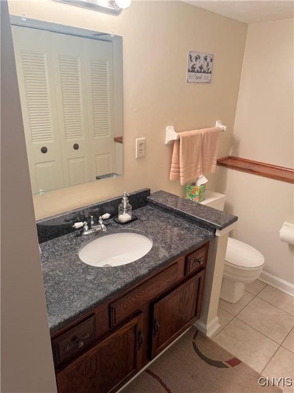 8467 Torchwood Ln, Cicero, NY 13039 - bathroom featuring vanity, tile patterned flooring, and a closet