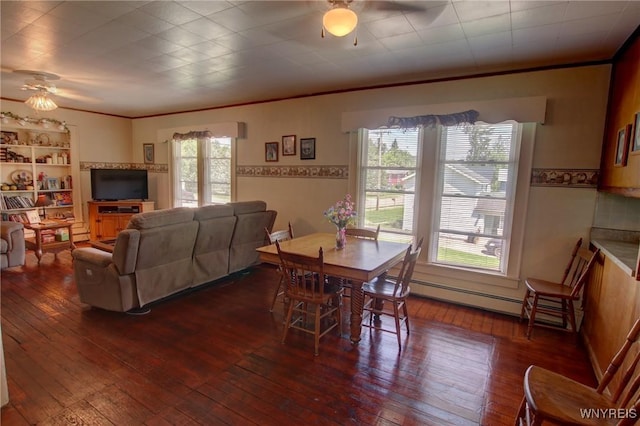 6716 Main St, Cherry Creek, NY 14723 - dining room with ceiling fan, a baseboard radiator, dark wood finished floors, and crown molding