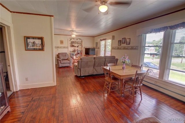 6716 Main St, Cherry Creek, NY 14723 - dining area with a ceiling fan, crown molding, dark wood-style floors, and baseboard heating