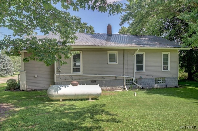 6716 Main St, Cherry Creek, NY 14723 - rear view of property featuring a chimney, a yard, and a metal roof