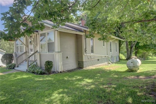 6716 Main St, Cherry Creek, NY 14723 - view of side of property with a lawn and a chimney