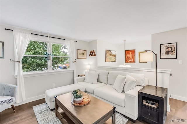 7052 Waring Cir, Evans, NY 14047 - living room featuring baseboards and wood finished floors