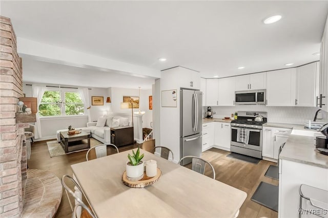 7052 Waring Cir, Evans, NY 14047 - dining space with wood finished floors and recessed lighting