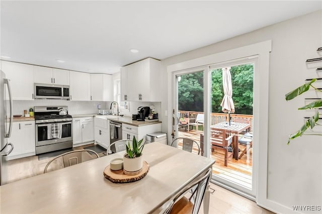 7052 Waring Cir, Evans, NY 14047 - dining room with recessed lighting and light wood finished floors