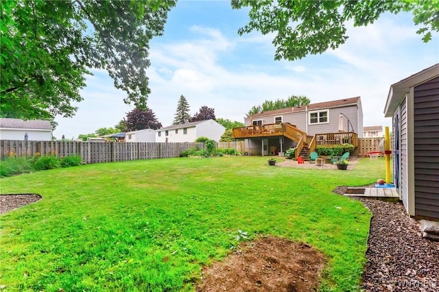 7052 Waring Cir, Evans, NY 14047 - fenced backyard featuring a wooden deck and stairway