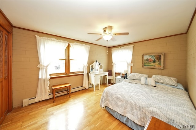 3461 Orchard Park Rd, Orchard Park, NY 14127 - bedroom with multiple windows, light wood finished floors, crown molding, ceiling fan, and a closet