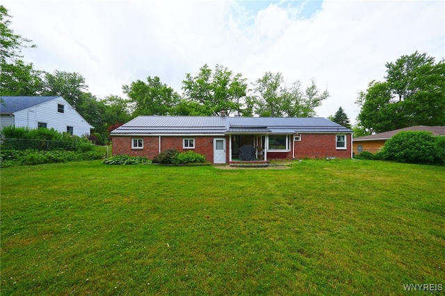 3461 Orchard Park Rd, Orchard Park, NY 14127 - rear view of house featuring brick siding and a chimney