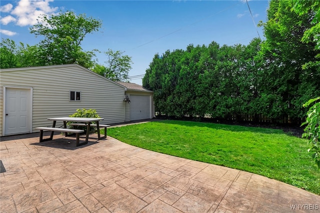 66 Devonshire Rd, Tonawanda, NY 14223 - view of patio featuring a garage and an outbuilding