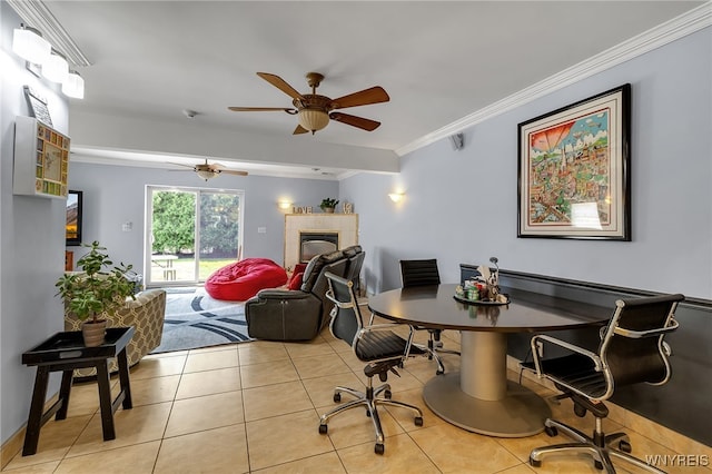 66 Devonshire Rd, Tonawanda, NY 14223 - home office featuring light tile patterned flooring, crown molding, a ceiling fan, and a tiled fireplace