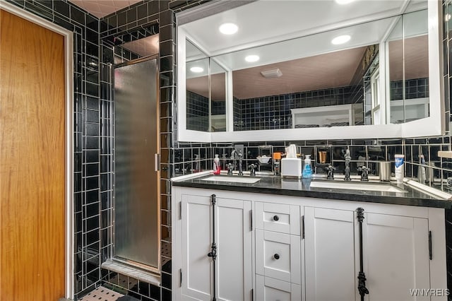 66 Devonshire Rd, Tonawanda, NY 14223 - bathroom featuring a stall shower, recessed lighting, double vanity, and tasteful backsplash