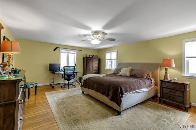 66 Devonshire Rd, Tonawanda, NY 14223 - bedroom with light wood-style flooring, ceiling fan, and a desk