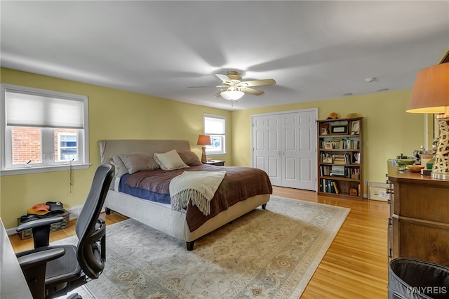 66 Devonshire Rd, Tonawanda, NY 14223 - bedroom featuring light wood-style floors, a closet, ceiling fan, and a desk