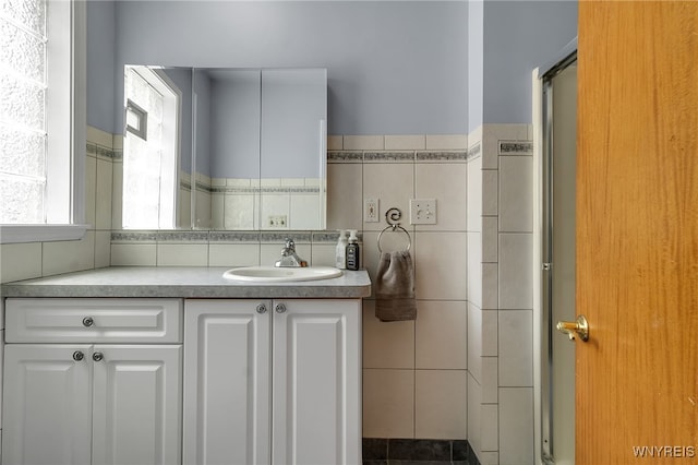 66 Devonshire Rd, Tonawanda, NY 14223 - full bath featuring vanity, tile walls, and a stall shower