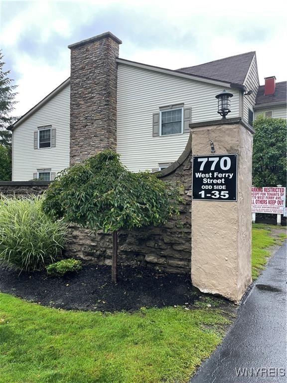 770 W Ferry St Unit 9A, Buffalo, NY 14222 - view of side of property featuring a chimney