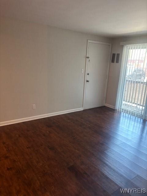 770 W Ferry St Unit 9A, Buffalo, NY 14222 - unfurnished room featuring dark wood-style flooring and baseboards