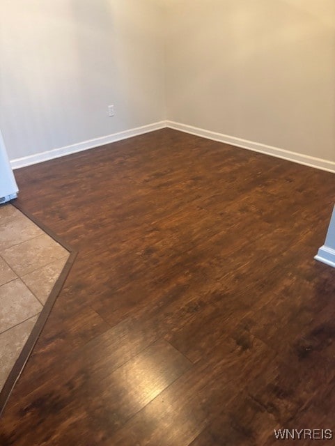 770 W Ferry St Unit 9A, Buffalo, NY 14222 - unfurnished room with baseboards and dark wood-style floors