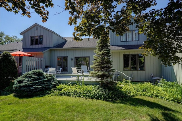 56 Waterview Cir, Penfield, NY 14625 - rear view of house featuring a lawn, a wooden deck, and roof with shingles