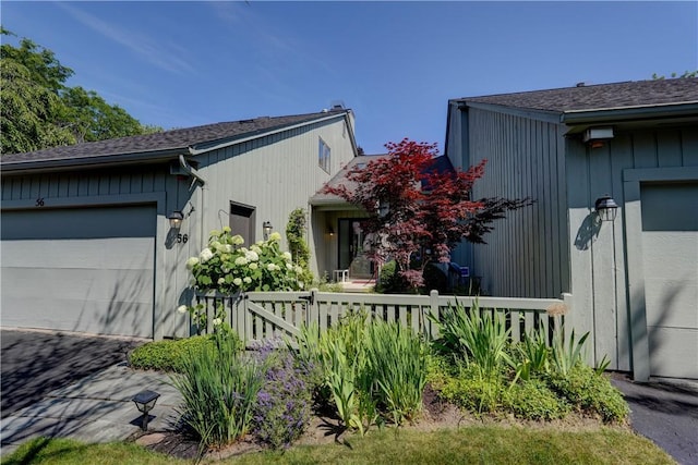 56 Waterview Cir, Penfield, NY 14625 - view of front of house with an attached garage, driveway, and roof with shingles