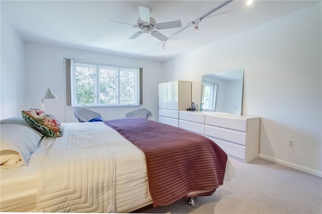 56 Waterview Cir, Penfield, NY 14625 - bedroom with track lighting, multiple windows, carpet flooring, and a ceiling fan