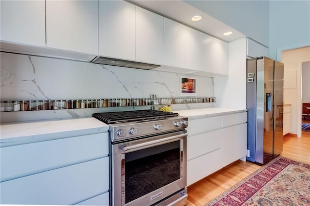 56 Waterview Cir, Penfield, NY 14625 - kitchen with stainless steel appliances, modern cabinets, light wood finished floors, white cabinets, and recessed lighting