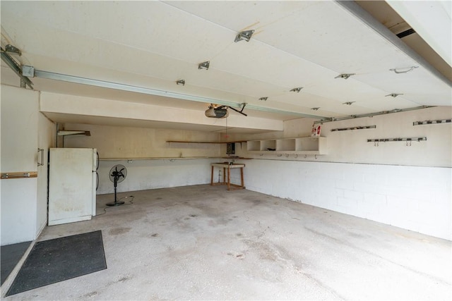 5 Yankee Ct, Chili, NY 14624 - garage featuring a garage door opener and freestanding refrigerator