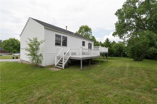 5 Yankee Ct, Chili, NY 14624 - rear view of property with a deck and a lawn