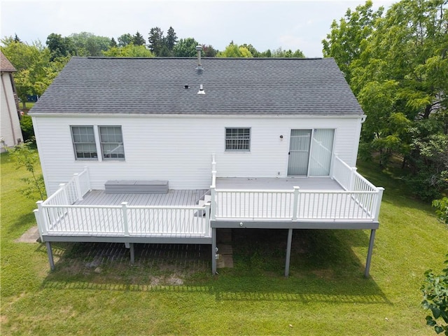 5 Yankee Ct, Chili, NY 14624 - rear view of house featuring a yard, a wooden deck, and roof with shingles