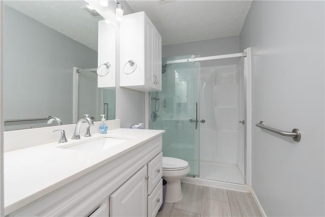 5 Yankee Ct, Chili, NY 14624 - bathroom with vanity, a shower stall, and a textured ceiling
