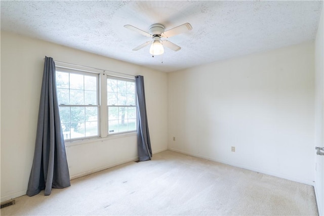 5 Yankee Ct, Chili, NY 14624 - spare room with light colored carpet, a ceiling fan, and a textured ceiling