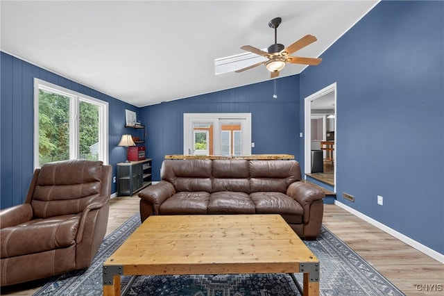 5647 Stevens Dr S, Cicero, NY 13039 - living area with lofted ceiling, healthy amount of natural light, a ceiling fan, light wood-style floors, and a skylight